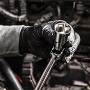 Hand wearing a black glove holding a ratchet wrench 