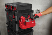 Person opening a red and black Milwaukee tool box with tools inside