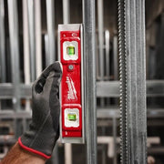 Hand holding a Milwaukee lLED Torpedo Level metal bars