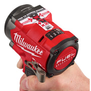 Red Milwaukee tool held in a hand 