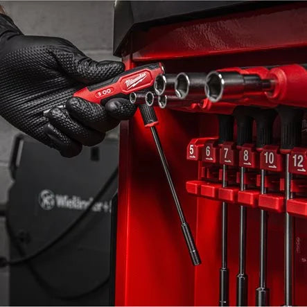 Milwaukee comfort grip nut driver being removed from rack during use