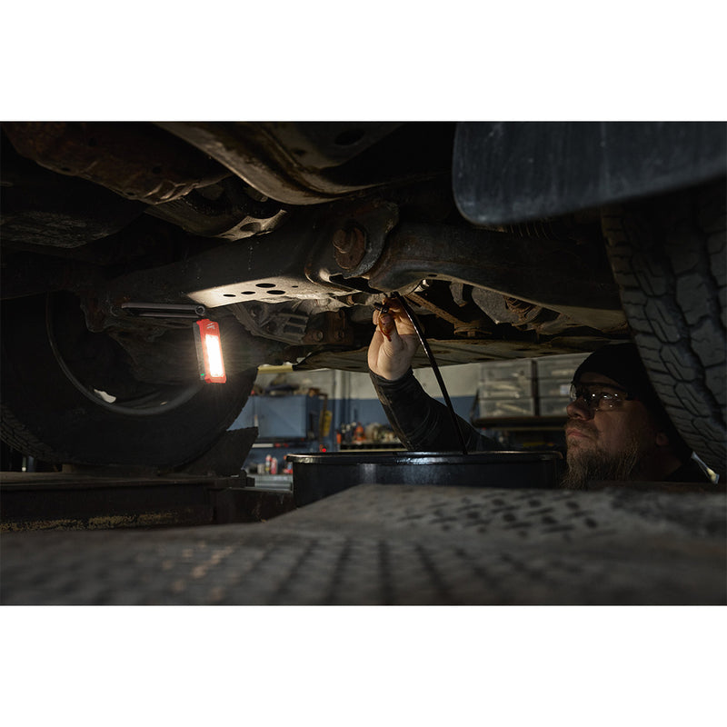 Milwaukee IR FFL folding flood light being used under a vehicle