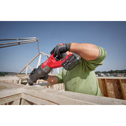 Milwaukee M18 FORGE 6.0Ah battery powering reciprocating saw outdoors