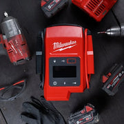 Milwaukee M18 Jump Starter JS2000-0 placed on workbench surrounded by M18 tools and accessories